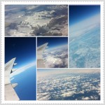Clouds, mountains, ice, ocean over Greenland