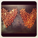 Two hazelnut hearts: one roasted and one raw