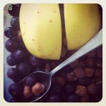 Frugal breakfast: apple, frozen blueberries & filberts
